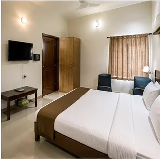 Clean practical budget lodge room prepared for arrival